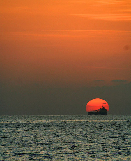 01 Tanker passes setting sun, Oman